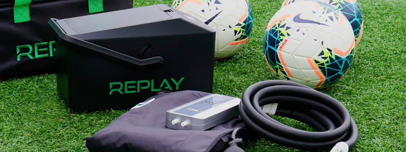 Replay Pro ice compression unit and wraps on soccer field for athlete recovery