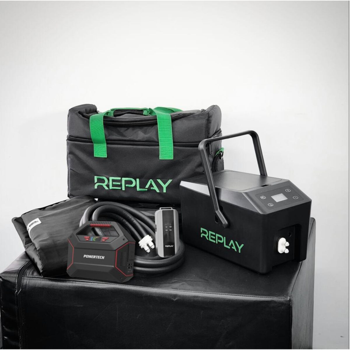 Replay Pro portable ice compression recovery system with battery pack, carry bag, wraps, and accessories displayed on white background for athlete recovery